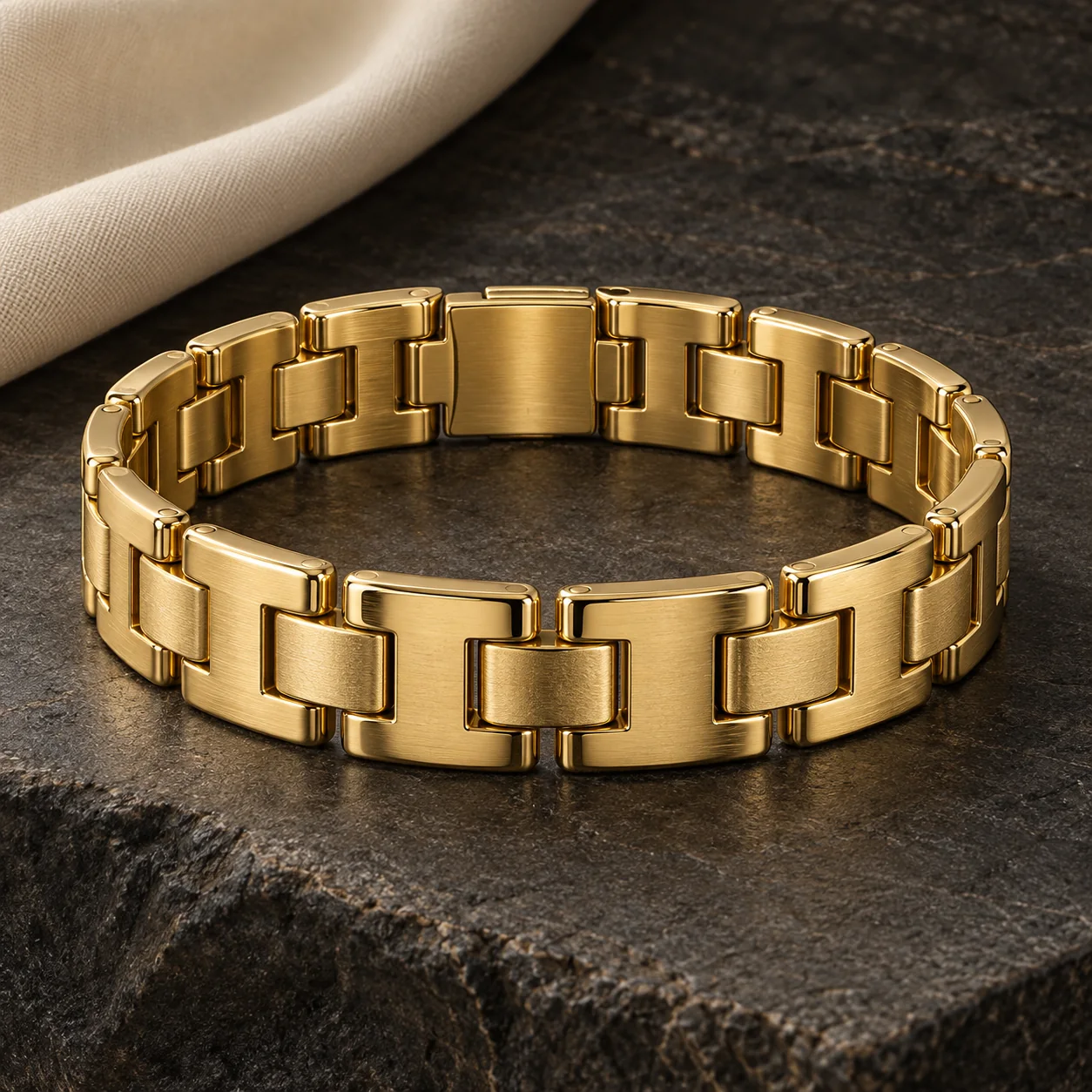 For Him collection - one substantial yellow-gold rectangular buckle bracelet with broad rounded interlocking H-shaped links, concealed clasp, satin centre channels, masculine 10mm proportions